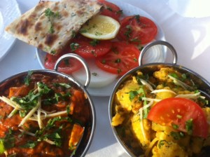 Paneer Jalfrezi (left) and Aloo Gobi, with a tomato and onion salad and a nan bread (Ganga)